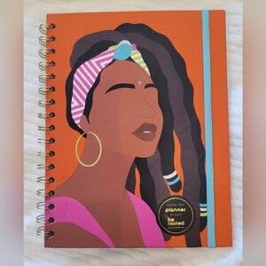 Vibrant Orange Planner with Artistic Woman Design